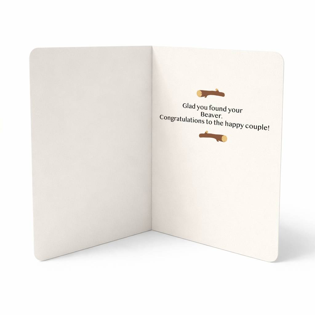 Open card with humorous text and beaver illustrations on a white background